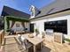 Back deck with an outdoor dining and seating area, and a built-in grill at 727 Cook Rd, Durham, NC 27713