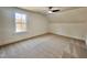 Bright bedroom featuring a window, carpeted floors and an attic ceiling at 727 Cook Rd, Durham, NC 27713
