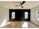 Bedroom showcasing hardwood floors and an accent wall with two windows at 727 Cook Rd, Durham, NC 27713