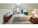A fully furnished bedroom with decor, furniture and a peaked ceiling with large window at 727 Cook Rd, Durham, NC 27713