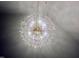 Close-up of a stunning crystal chandelier, creating a luxurious ambiance at 727 Cook Rd, Durham, NC 27713