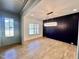 Spacious dining room features a contemporary light fixture and dark blue accent wall at 727 Cook Rd, Durham, NC 27713