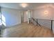 Open hallway features hardwood floors, modern lighting, and views to other rooms at 727 Cook Rd, Durham, NC 27713