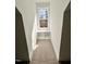 Hallway nook featuring a window with a cushioned bench and built-in storage at 727 Cook Rd, Durham, NC 27713