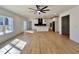 Open-concept living room and kitchen with hardwood floors, recessed lighting, and views of the outside at 727 Cook Rd, Durham, NC 27713
