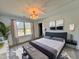 Stylishly furnished main bedroom with a tufted headboard and decorative lighting at 727 Cook Rd, Durham, NC 27713