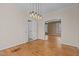 Open dining room with hardwood floors and views to living room at 96 Double Oak Dr, Pittsboro, NC 27312