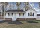 Charming one-story home with a brick facade and a covered porch at 100 Beaver Ridge Way, Benson, NC 27504