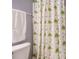 Bathroom featuring patterned shower curtain, white toilet, and towel at 125 Watertree Ln, Apex, NC 27502
