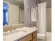 Bathroom with vanity, mirror, granite countertop, and a shower/tub with a white curtain at 125 Watertree Ln, Apex, NC 27502