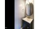 Compact bathroom with a sleek vanity, modern mirror and neutral wall color at 125 Watertree Ln, Apex, NC 27502