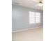 Bedroom featuring carpet, ceiling fan, and a window for natural light at 125 Watertree Ln, Apex, NC 27502