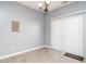 Dining room with chandelier and a sliding door, letting in lots of light at 125 Watertree Ln, Apex, NC 27502