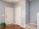 Inviting entryway with hardwood floors, a neutral paint color and white doors at 125 Watertree Ln, Apex, NC 27502