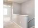 Hallway view with gray walls, white trim, and carpet flooring at 125 Watertree Ln, Apex, NC 27502