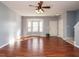 Spacious living room with hardwood floors, large bay window, and neutral paint at 125 Watertree Ln, Apex, NC 27502
