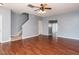 Open living area with hardwood floors, staircase, and neutral wall color at 125 Watertree Ln, Apex, NC 27502