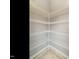 Pantry featuring white metal shelves and tiled floor at 125 Watertree Ln, Apex, NC 27502