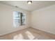Bright bedroom featuring neutral carpet and natural light streaming in from a window at 1300 Durlain Dr # 108, Raleigh, NC 27614