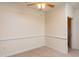 Empty bedroom with beige carpet, ceiling fan, neutral paint and traditional style baseboard at 1300 Durlain Dr # 108, Raleigh, NC 27614