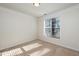 Bright bedroom with neutral carpet and natural light from a window at 1300 Durlain Dr # 108, Raleigh, NC 27614