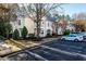 Condo building exterior showcasing multiple units, landscaping, and parking spaces at 1300 Durlain Dr # 108, Raleigh, NC 27614