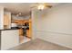 Bright kitchen with stainless steel appliances and wooden cabinets seamlessly transitions into the dining area at 1300 Durlain Dr # 108, Raleigh, NC 27614