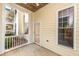 Covered patio featuring a glass door and window with a view at 1300 Durlain Dr # 108, Raleigh, NC 27614