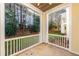 Covered outdoor patio with a view of trees and neighboring buildings at 1300 Durlain Dr # 108, Raleigh, NC 27614