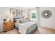 Cozy bedroom with a queen bed and natural light at 180 Paper Birch Way, Fuquay Varina, NC 27526