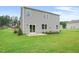 Newly built home with sliding glass door access to backyard patio at 197 Paper Birch Way, Fuquay Varina, NC 27526