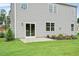 Newly built home with sliding glass door access to backyard patio at 197 Paper Birch Way, Fuquay Varina, NC 27526