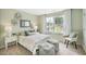 Charming bedroom with soft color palette and large windows at 197 Paper Birch Way, Fuquay Varina, NC 27526