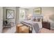 Charming bedroom with metal bed frame and two yellow ottomans at 197 Paper Birch Way, Fuquay Varina, NC 27526