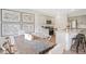 Charming dining room features a rustic table and botanical prints at 197 Paper Birch Way, Fuquay Varina, NC 27526