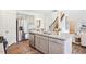 Kitchen with gray cabinets, granite countertops, and stainless steel appliances at 197 Paper Birch Way, Fuquay Varina, NC 27526
