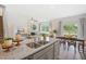 Open-concept kitchen with island, granite countertops and stainless steel appliances at 197 Paper Birch Way, Fuquay Varina, NC 27526