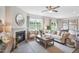 Open living room showcasing a fireplace and access to kitchen at 197 Paper Birch Way, Fuquay Varina, NC 27526