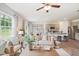 Open concept living room with kitchen views and ample natural light at 197 Paper Birch Way, Fuquay Varina, NC 27526