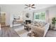 Spacious living room features a fireplace, large windows, and comfortable seating at 197 Paper Birch Way, Fuquay Varina, NC 27526