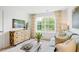 Relaxing sitting area with a sofa and plenty of natural light at 197 Paper Birch Way, Fuquay Varina, NC 27526
