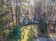 Aerial view of house and surrounding property with mature trees at 2801 Chelsea Cir, Durham, NC 27707
