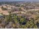 Aerial view of neighborhood near golf course and lush trees at 2801 Chelsea Cir, Durham, NC 27707