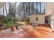 Peaceful backyard patio with seating area and terracotta tile at 2801 Chelsea Cir, Durham, NC 27707