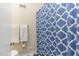 Clean bathroom with blue shower curtain and white towels at 2801 Chelsea Cir, Durham, NC 27707