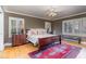 Bright bedroom with hardwood floors and a comfortable bed at 2801 Chelsea Cir, Durham, NC 27707