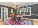 Elegant dining room, featuring a chandelier and rich rug at 2801 Chelsea Cir, Durham, NC 27707
