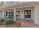 Inviting front porch with rocking chairs, and brick flooring at 2801 Chelsea Cir, Durham, NC 27707