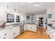 Spacious kitchen featuring stainless steel appliances and white cabinets at 2801 Chelsea Cir, Durham, NC 27707