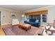 Comfortable living room with navy sofa and hardwood floors at 2801 Chelsea Cir, Durham, NC 27707
